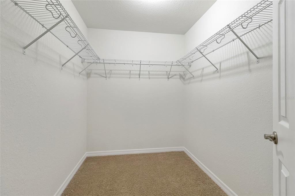 14162 Southwest 16th Place Dunnellon, FL 34432 - Photo 8 of 15 a view of a room with racks on the wall