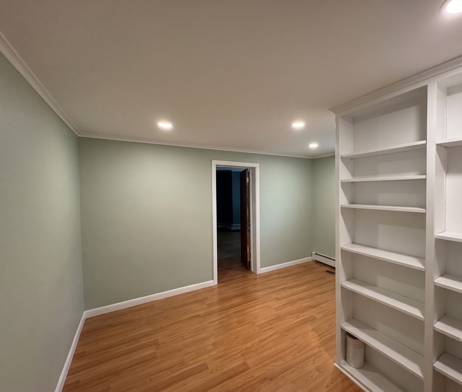 27 High Street Sturbridge, MA 01518 - Photo 5 of 17 a view of an empty room with wooden floor and a window