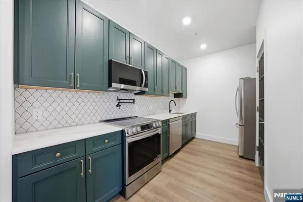 a kitchen with a stove and a microwave