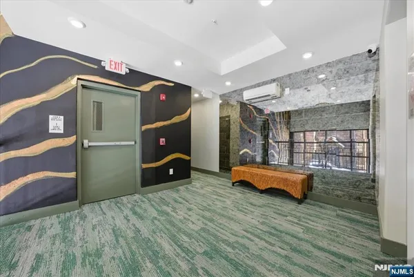 a bathroom with a glass shower door