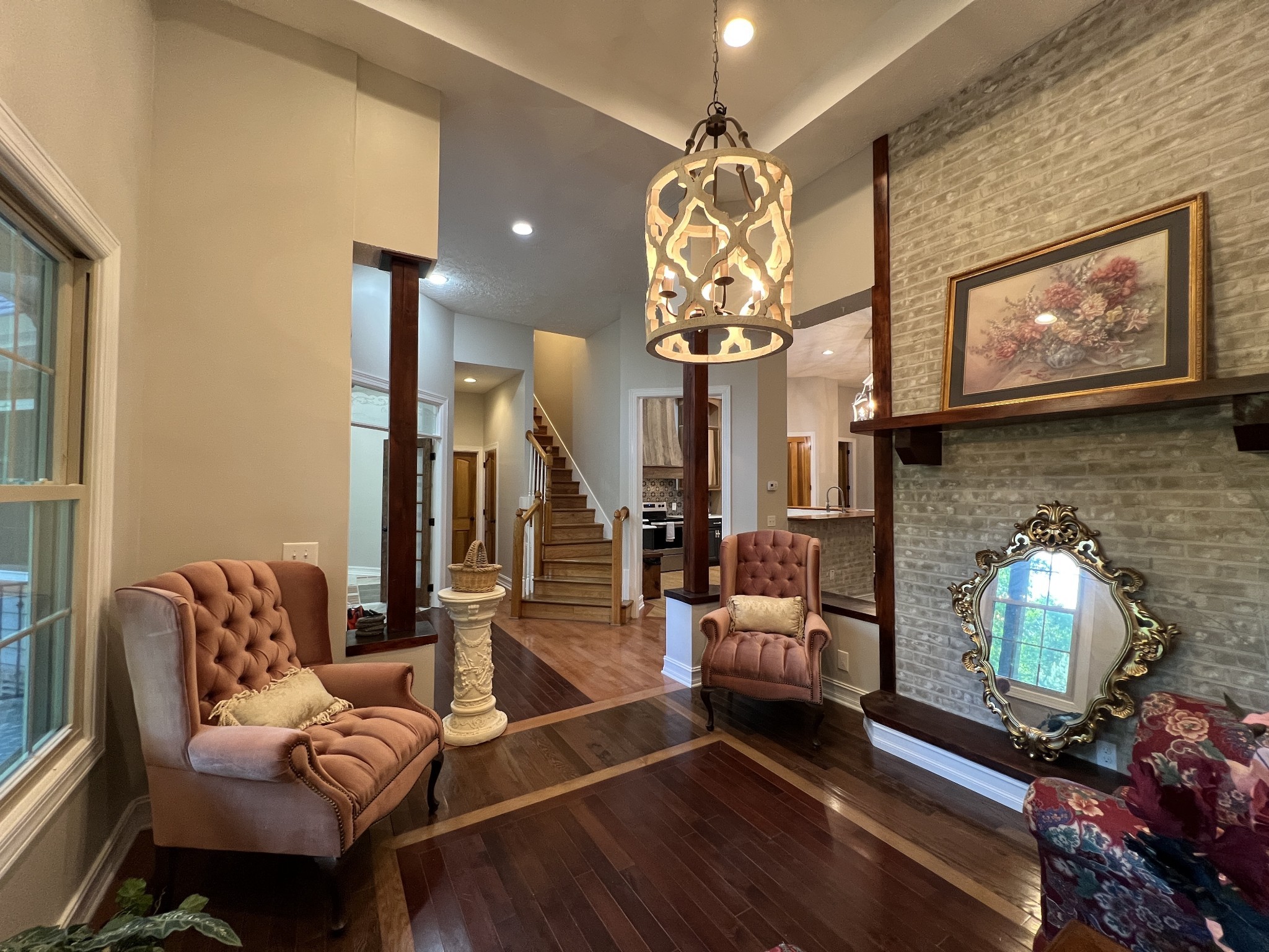 550 Laurel Crown Road Manchester, TN 37355 - Photo 24 of 87 a living room with furniture a chandelier and a fireplace