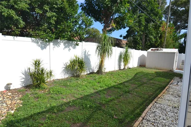 a view of a backyard of a house