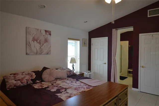 a bed room with a bed and a couch