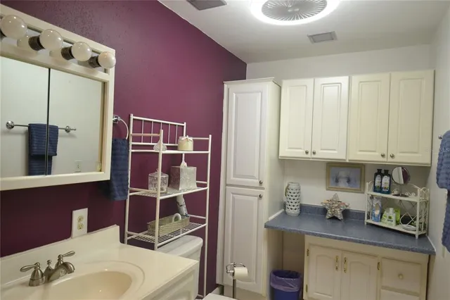 a view of a house with swimming pool and sitting area