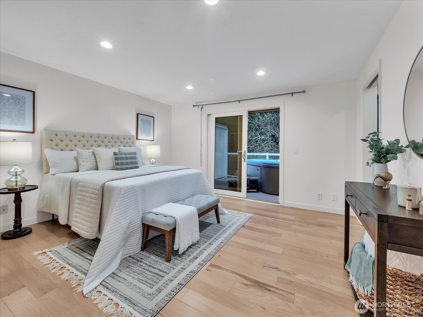20921 28th Avenue Southeast Bothell, WA 98021 - Photo 11 of 37 a bedroom with a large bed and a potted plant
