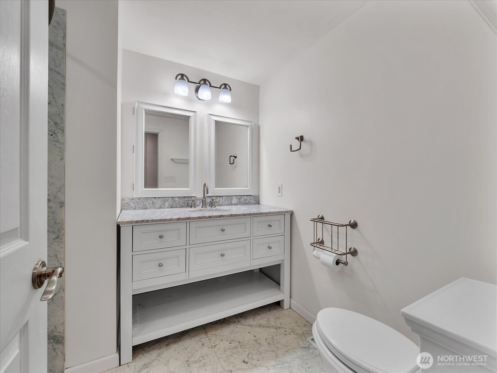 20921 28th Avenue Southeast Bothell, WA 98021 - Photo 20 of 37 a bathroom with a sink vanity mirror and toilet