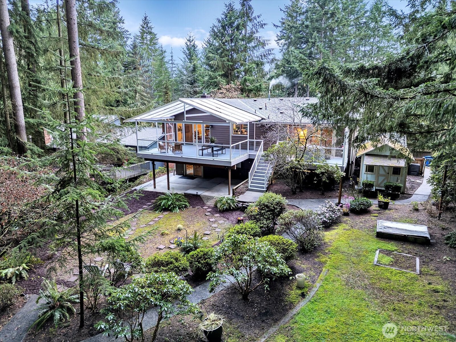 20921 28th Avenue Southeast Bothell, WA 98021 - Photo 2 of 37 a front view of a house with garden