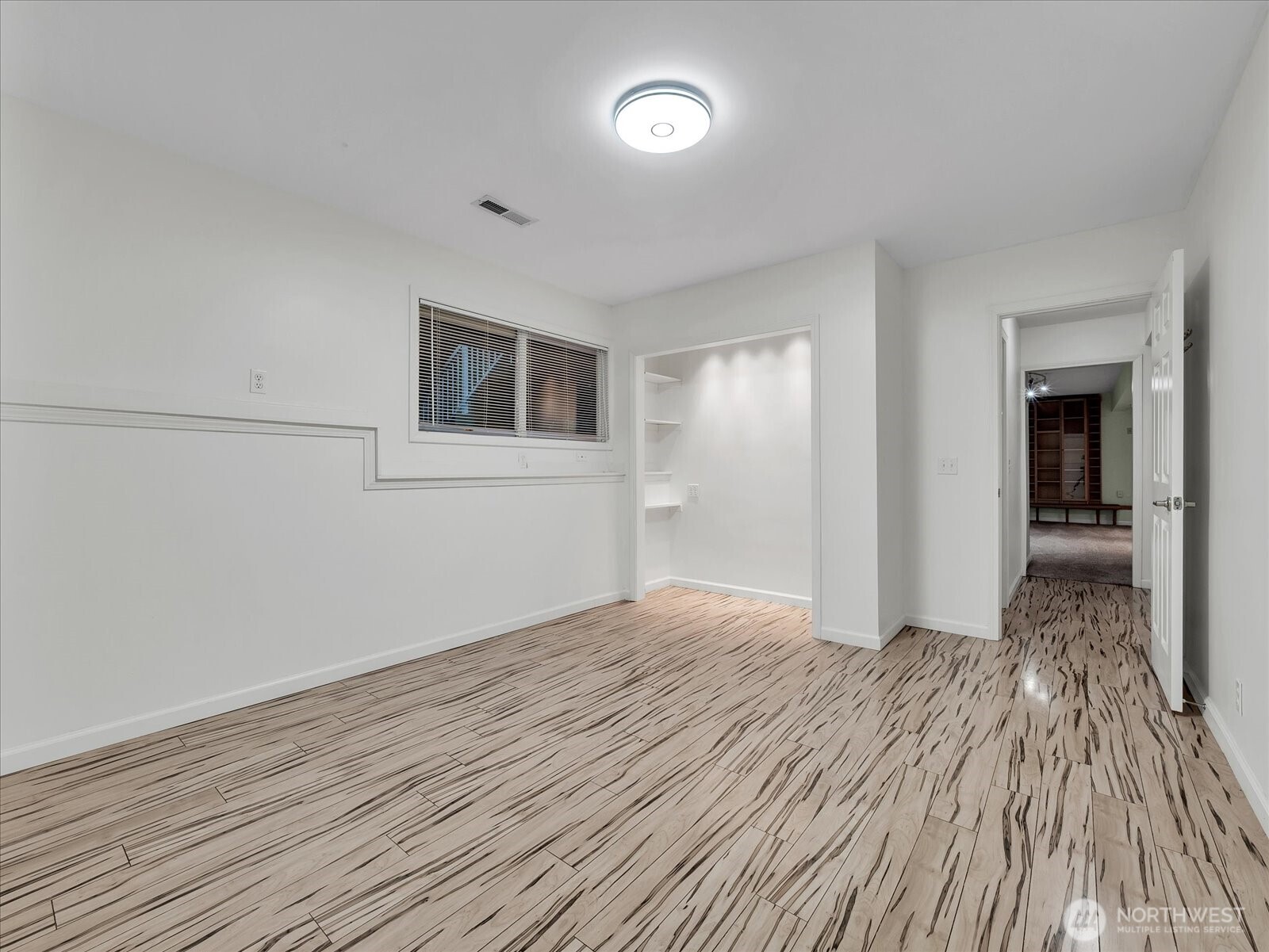 20921 28th Avenue Southeast Bothell, WA 98021 - Photo 27 of 37 a view of a livingroom with wooden floor and a ceiling fan