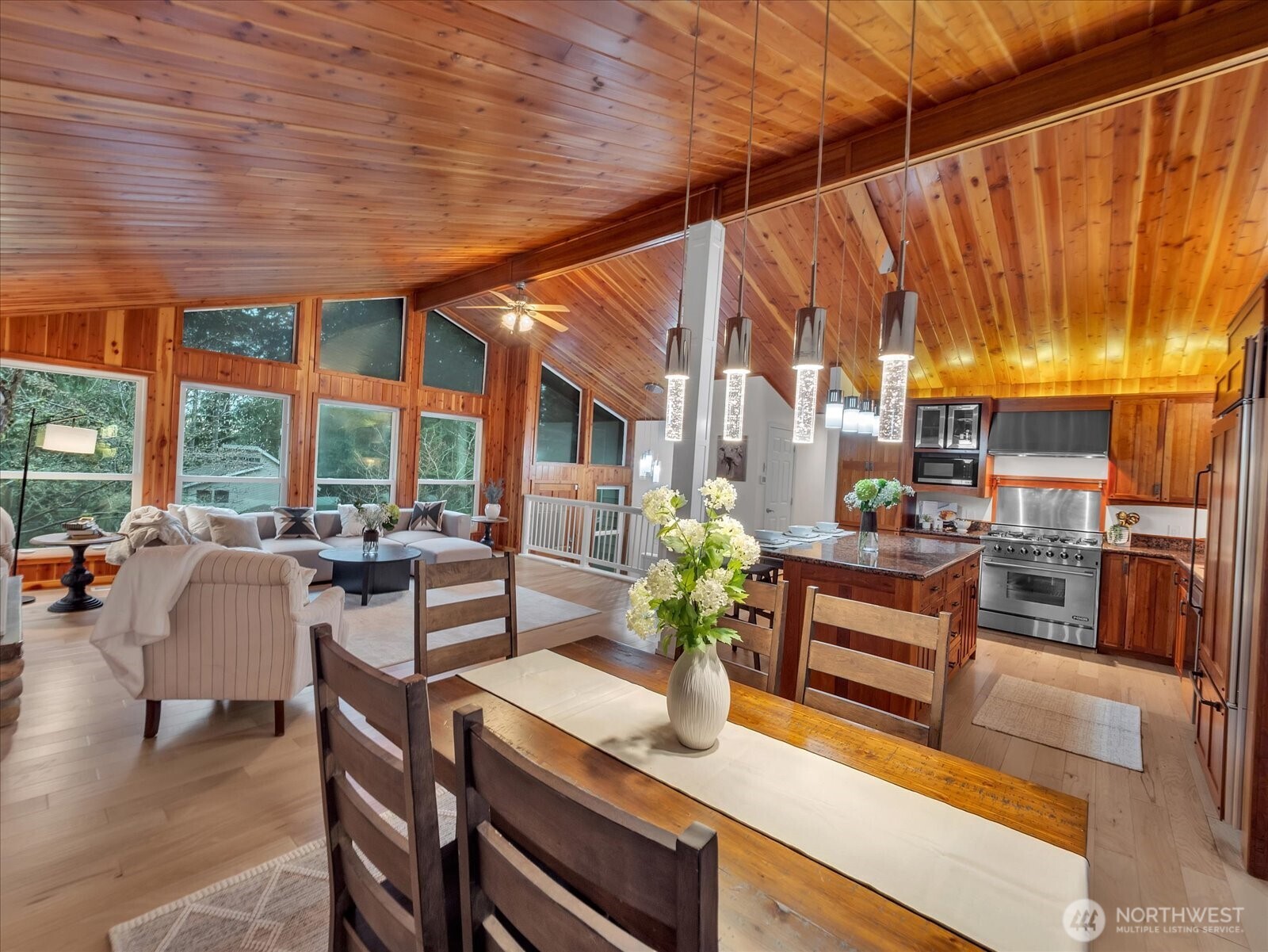 20921 28th Avenue Southeast Bothell, WA 98021 - Photo 4 of 37 a dining room with furniture and a floor to ceiling window