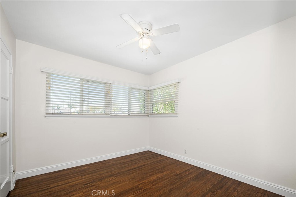 2154 North Studebaker Road Long Beach, CA 90815 - Photo 16 of 37 an empty room with wooden floor and windows