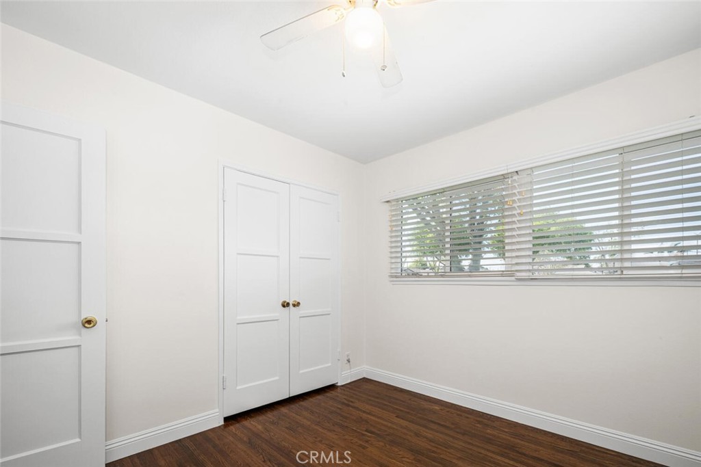 2154 North Studebaker Road Long Beach, CA 90815 - Photo 17 of 37 a view of an empty room with wooden floor and a window