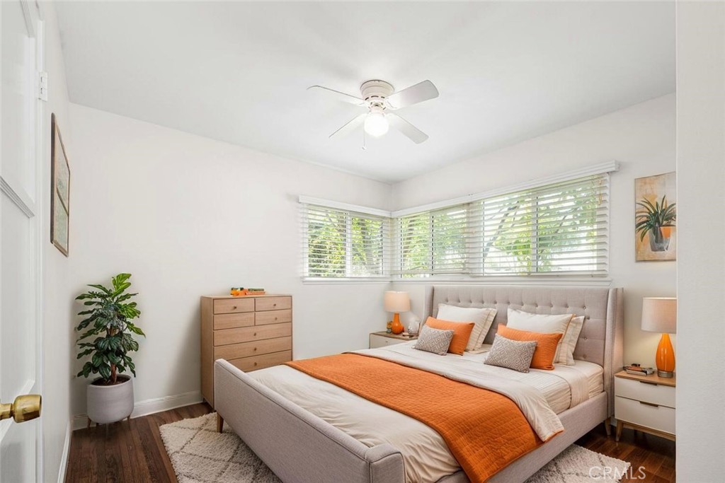2154 North Studebaker Road Long Beach, CA 90815 - Photo 19 of 37 a bedroom with a bed and a potted plant