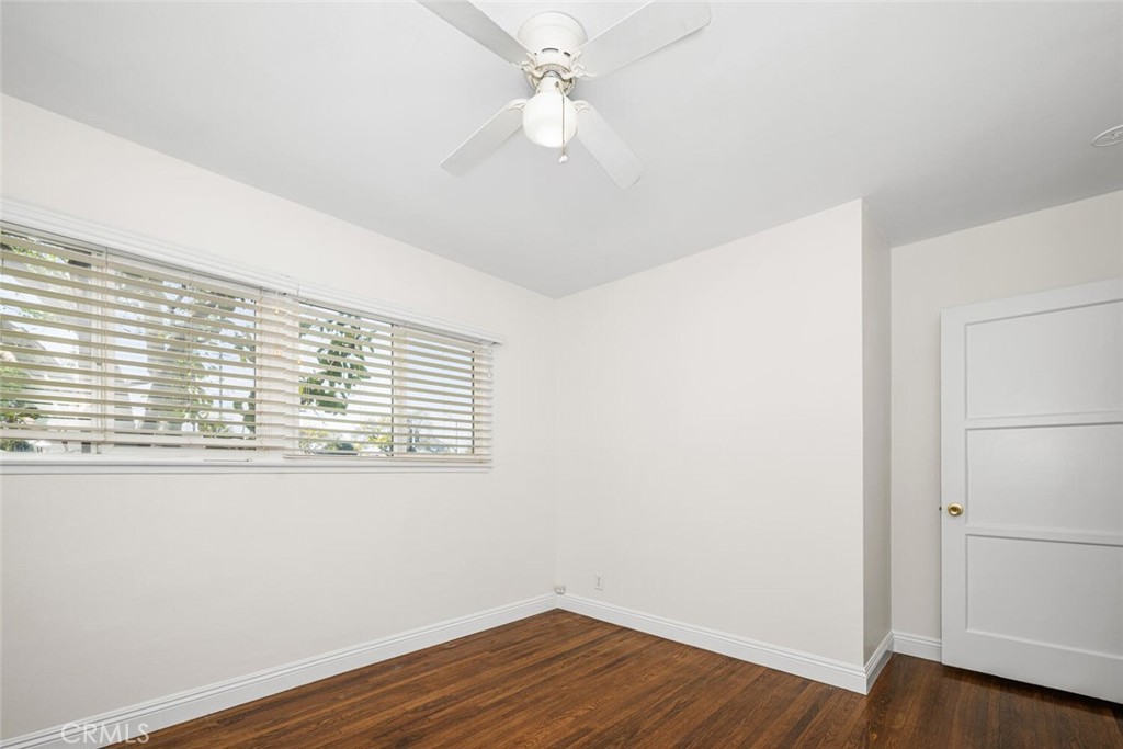 2154 North Studebaker Road Long Beach, CA 90815 - Photo 21 of 37 an empty room with wooden floor and windows