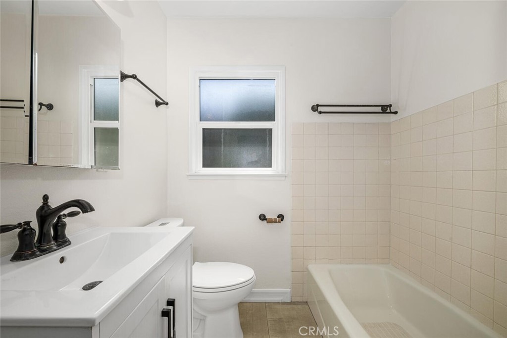 2154 North Studebaker Road Long Beach, CA 90815 - Photo 24 of 37 a bathroom with a sink a toilet and shower