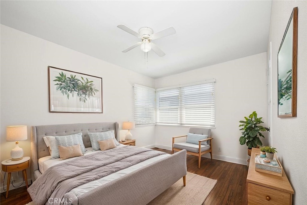 2154 North Studebaker Road Long Beach, CA 90815 - Photo 26 of 37 a spacious bedroom with a large bed and potted plant