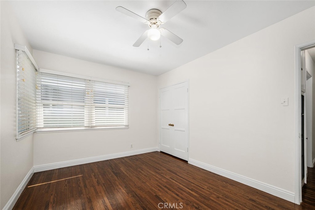 2154 North Studebaker Road Long Beach, CA 90815 - Photo 28 of 37 a view of an empty room with wooden floor and a window