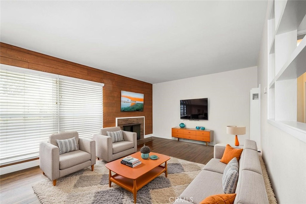 2154 North Studebaker Road Long Beach, CA 90815 - Photo 3 of 37 a living room with furniture and a flat screen tv