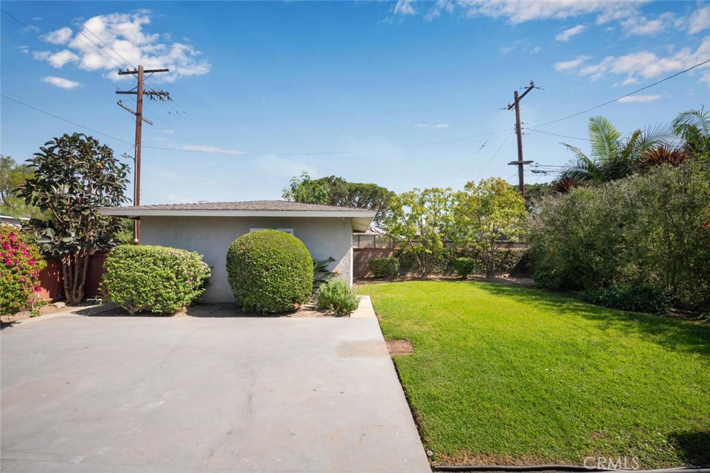 2154 North Studebaker Road Long Beach, CA 90815 - Photo 31 of 37 a front view of a house with garden