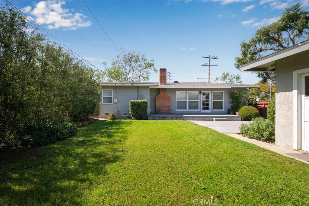 2154 North Studebaker Road Long Beach, CA 90815 - Photo 34 of 37 a front view of a house with a yard