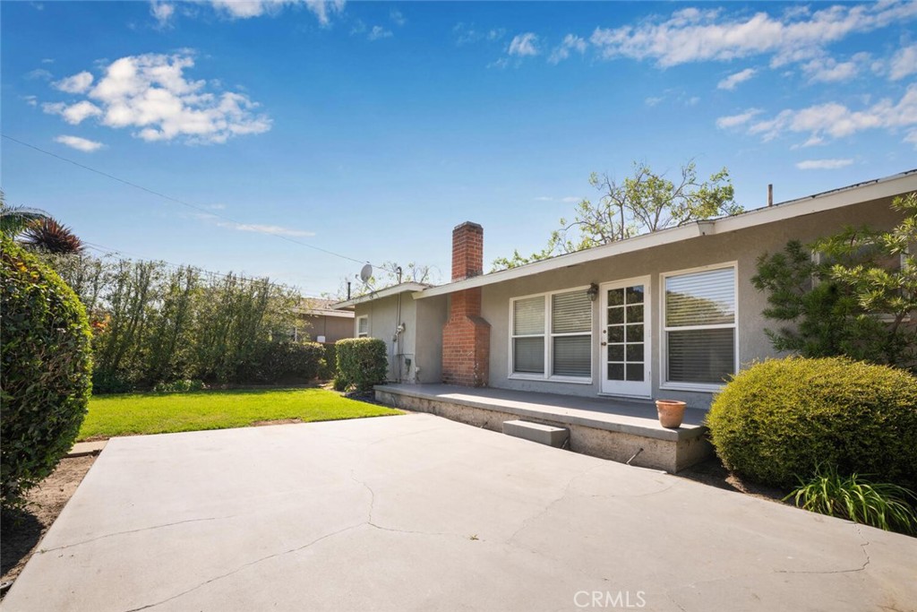 2154 North Studebaker Road Long Beach, CA 90815 - Photo 35 of 37 a view of a house with swimming pool and a yard