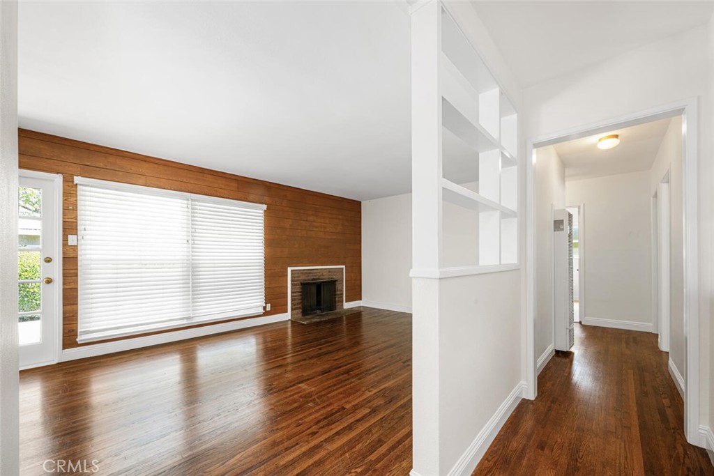 2154 North Studebaker Road Long Beach, CA 90815 - Photo 5 of 37 wooden floor in an empty room with a window