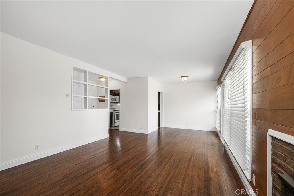2154 North Studebaker Road Long Beach, CA 90815 - Photo 8 of 37 wooden floor in an empty room with a window