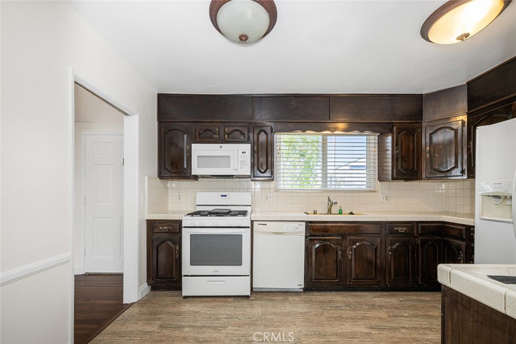 2154 North Studebaker Road Long Beach, CA 90815 - Photo 9 of 37 a kitchen with a sink and cabinets