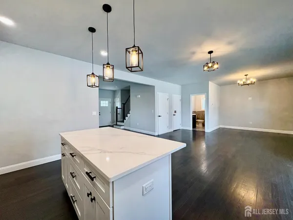 a spacious bathroom with a double vanity sink mirror and bathtub