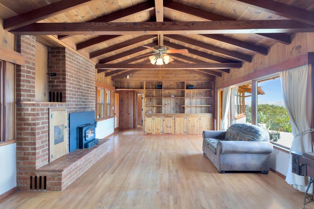 1575 Crest Drive Encinitas, CA 92024 - Photo 22 of 52 a living room with furniture and a fireplace