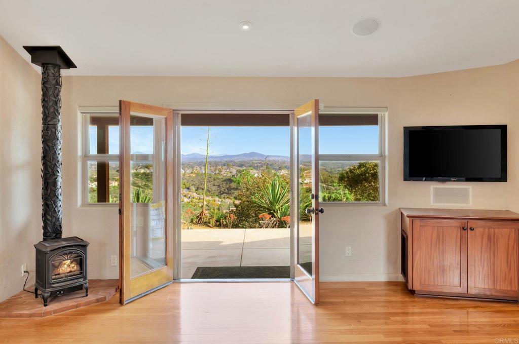 1575 Crest Drive Encinitas, CA 92024 - Photo 30 of 52 a living room with furniture and a flat screen tv