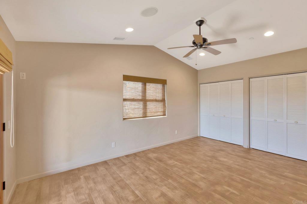 1575 Crest Drive Encinitas, CA 92024 - Photo 43 of 52 an empty room with windows and fan