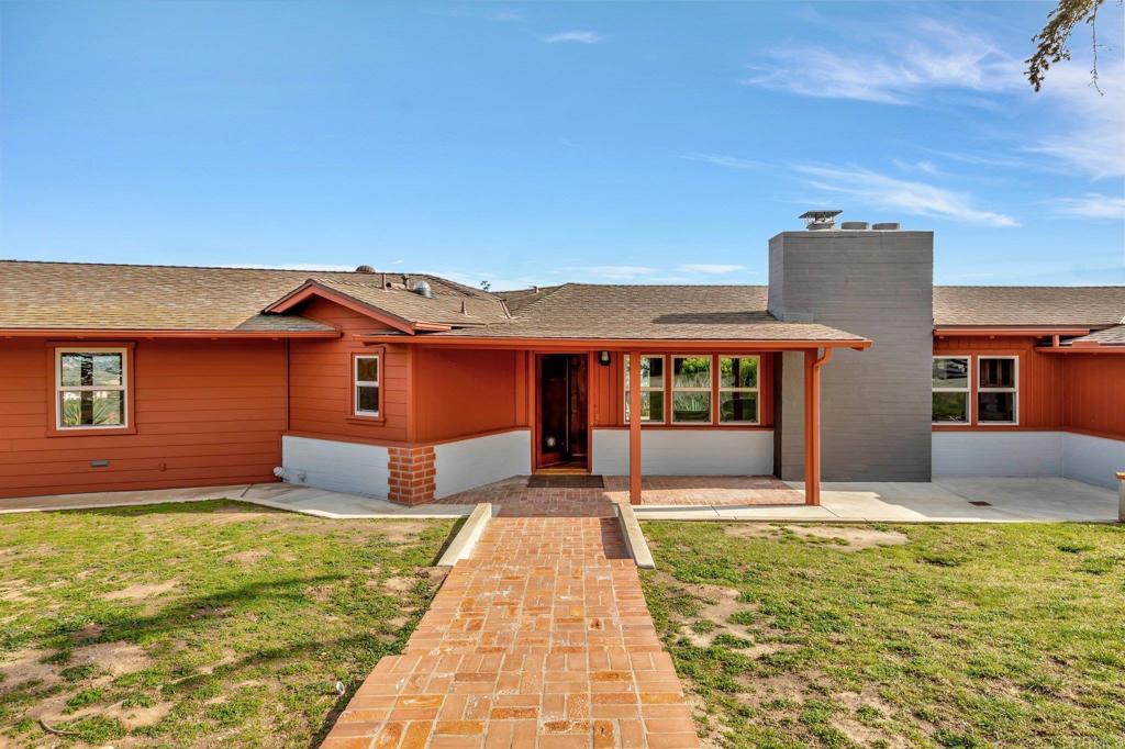 1575 Crest Drive Encinitas, CA 92024 - Photo 5 of 52 a front view of a house with a yard
