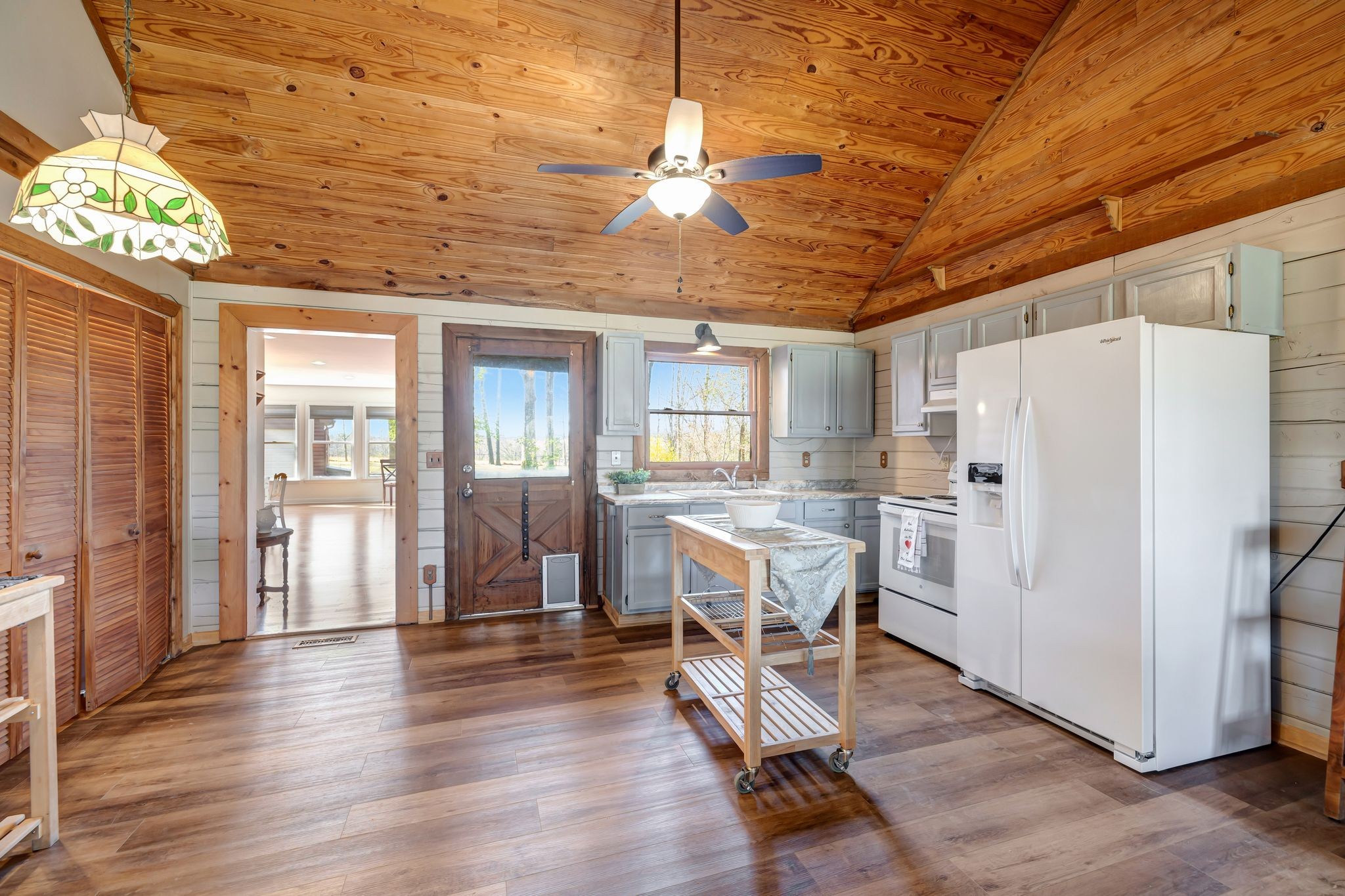 7116 King Road Fairview, TN 37062 - Photo 6 of 40 a dining room with wooden floor and a refrigerator