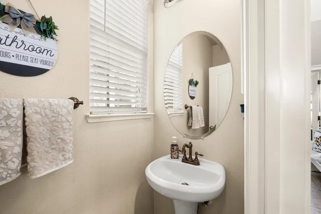 a view of a livingroom with wooden floor and furniture