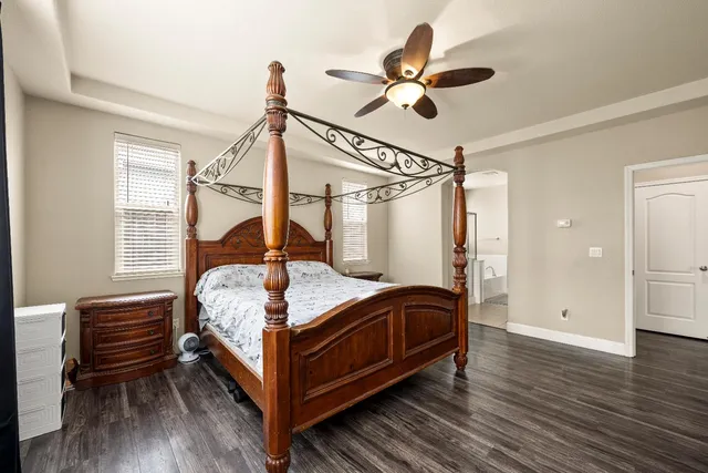 a bathroom with a tub shower and a sink