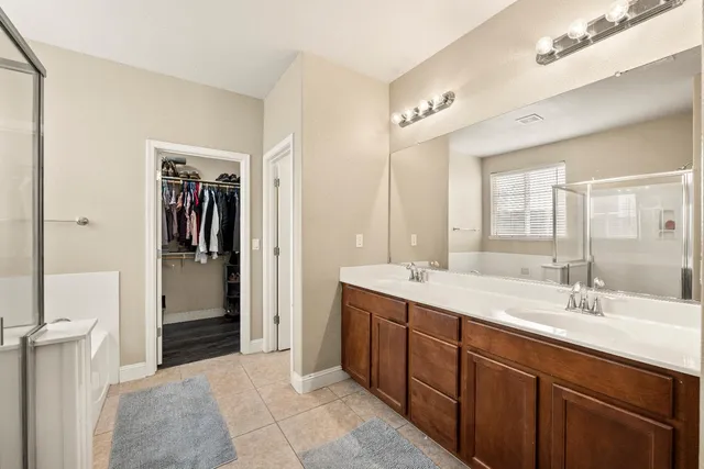 a bathroom with a tub and a window