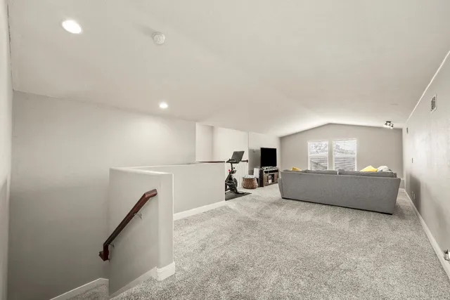 a bedroom with a bed and a desk