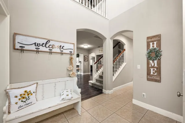 a view of a workspace with furniture and wooden floor