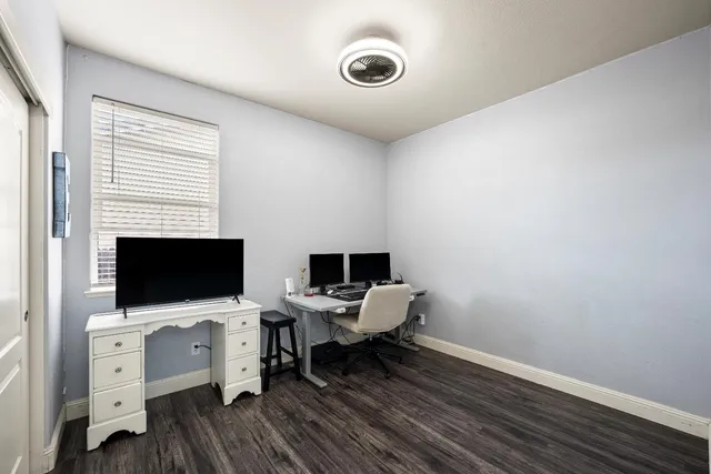 a bathroom with a sink a toilet a mirror and shower curtain