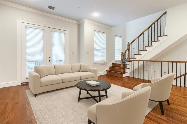 a living room with furniture and a table