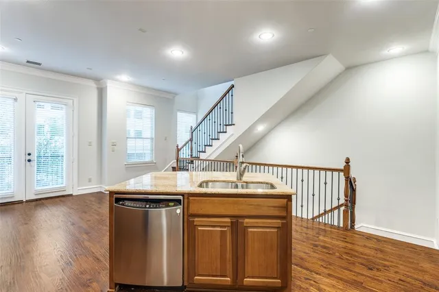 a hallway with table mirror and wooden floor