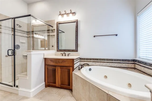 a bathroom with a bathtub and a sink