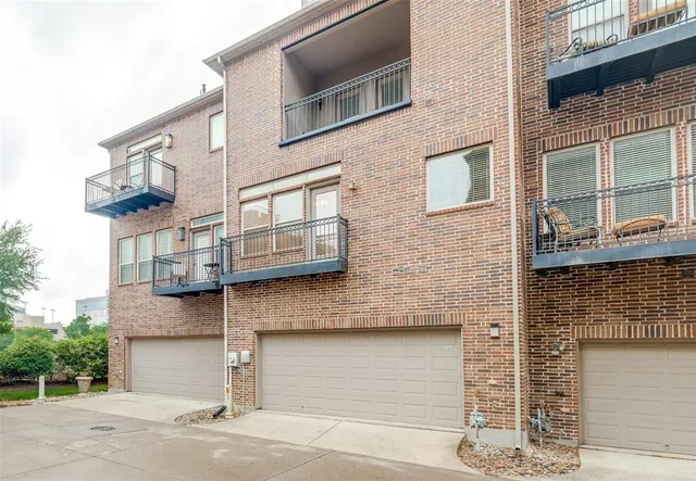 a view of a building with a window and garage