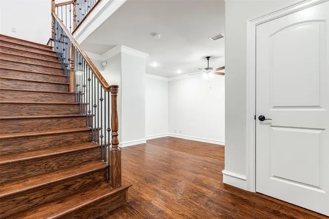 a view of an entryway with wooden floor