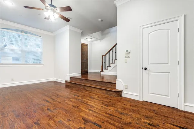 a view of an entryway with wooden floor and a window