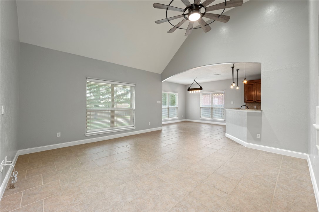 3304 Keefer Loop College Station, TX 77845 - Photo 3 of 21 an empty room with windows and ceiling fan