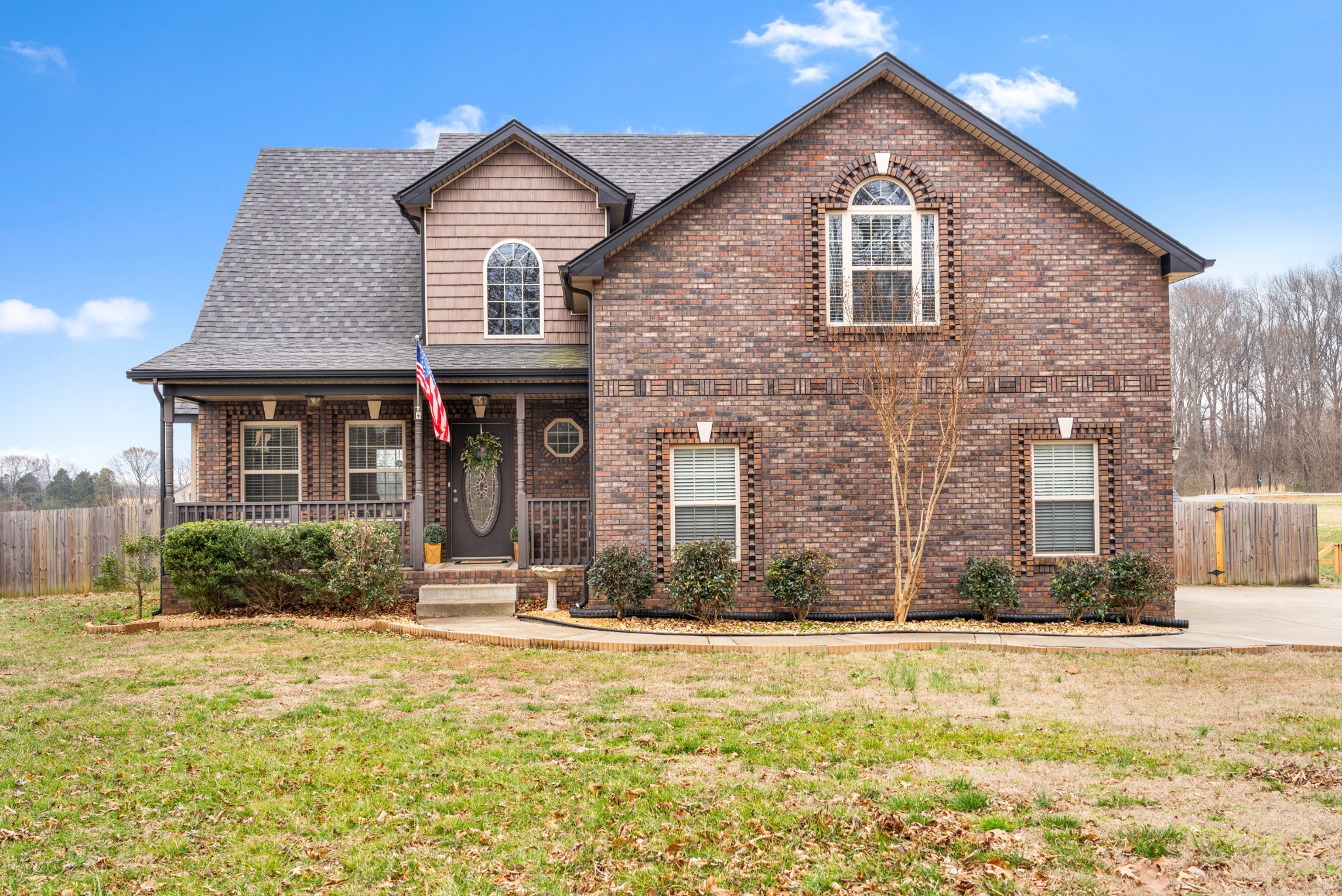 a front view of a house with a yard