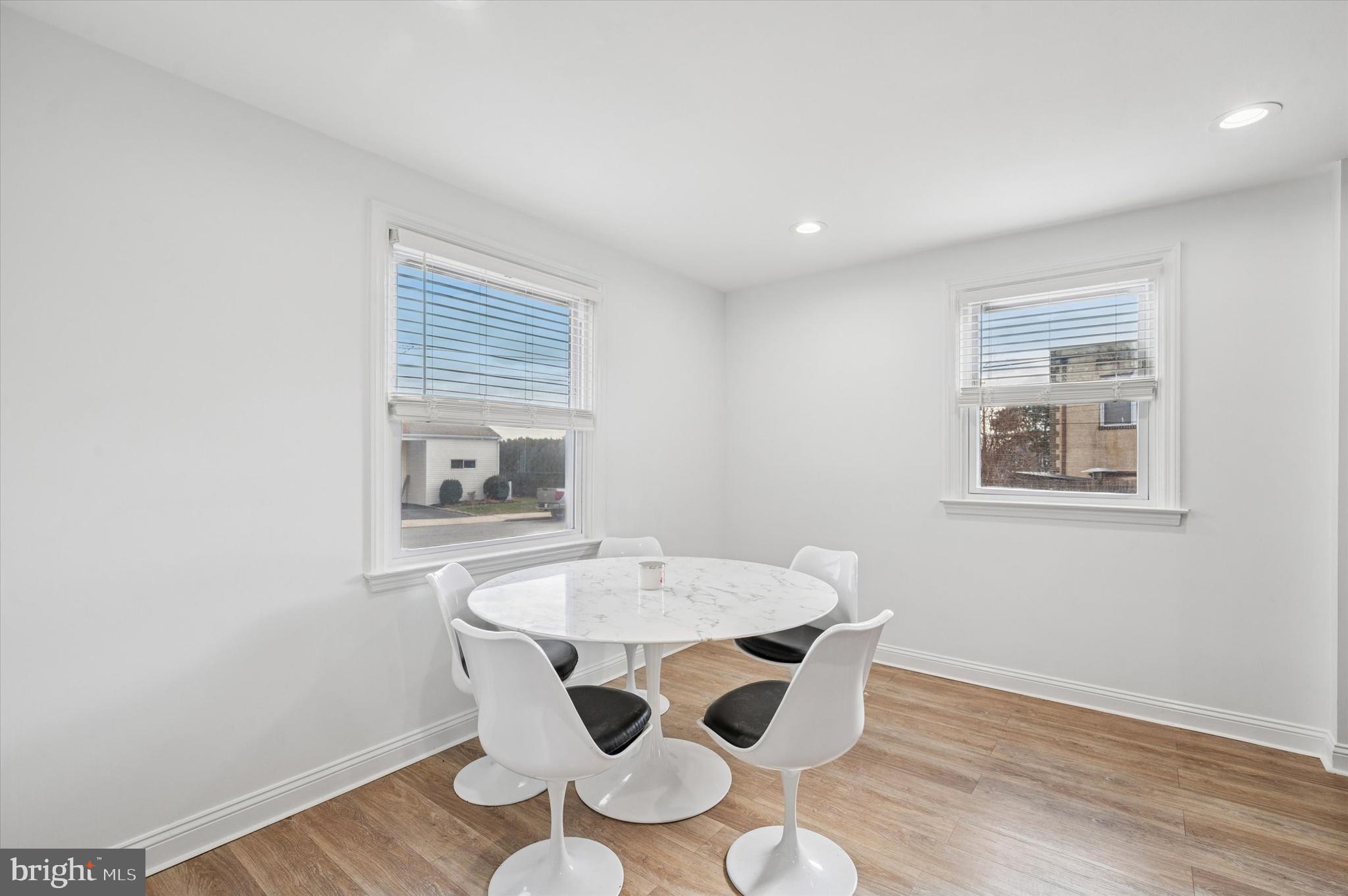 24 Upland Road Havertown, PA 19083 - Photo 11 of 28 a view of a dining room with furniture and wooden floor