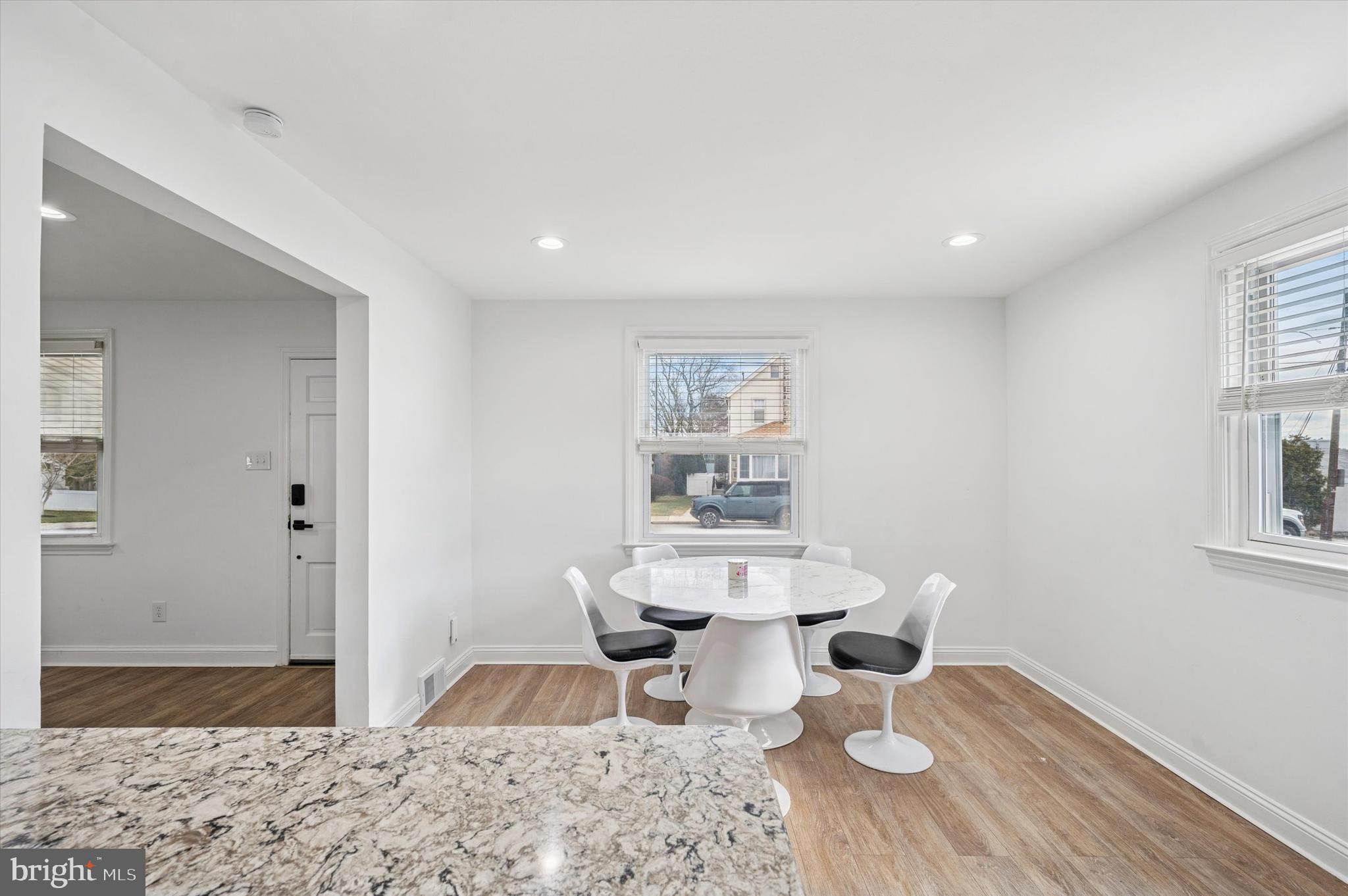24 Upland Road Havertown, PA 19083 - Photo 15 of 28 a dining room with wooden floor and white walls