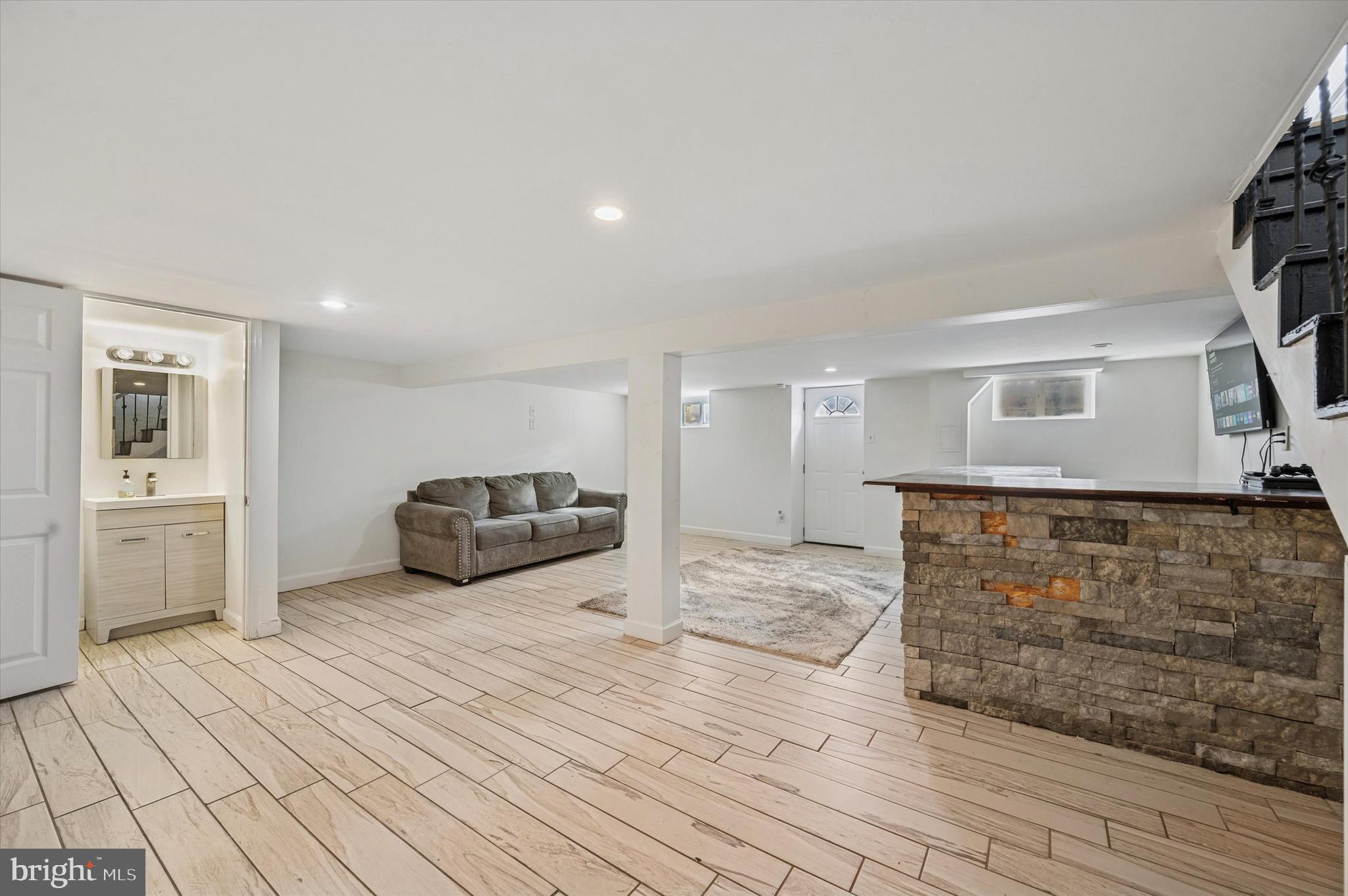 24 Upland Road Havertown, PA 19083 - Photo 23 of 28 a living room with a couch and a rug